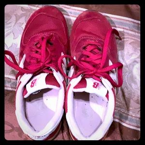Red new balance shoes.